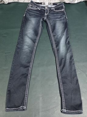 **Dark Wash Jeans with White Contrast Stitching**